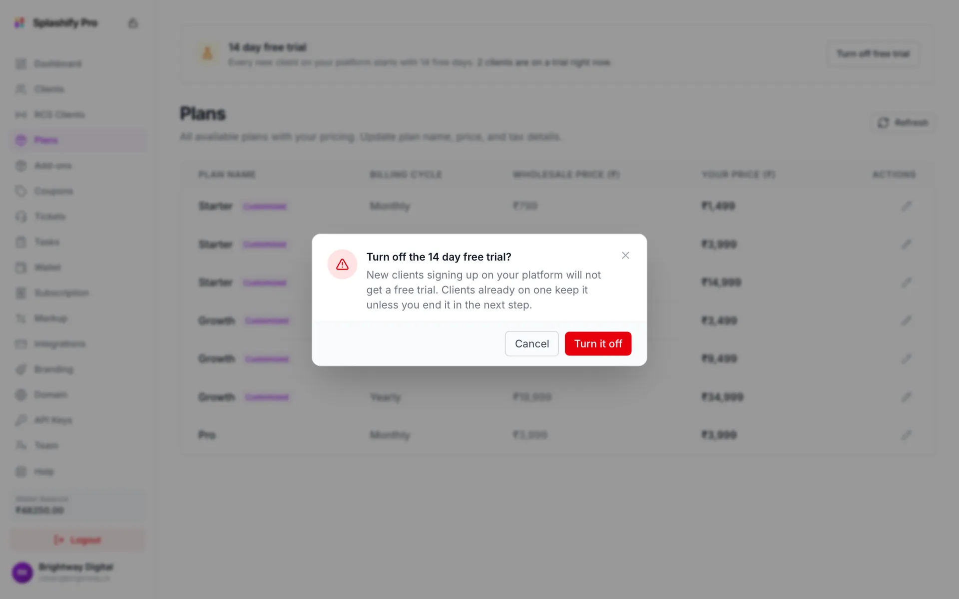 A confirm box: Turn off the 7 day free trial? New clients signing up on your platform will not get a free trial, with Cancel and Turn it off buttons